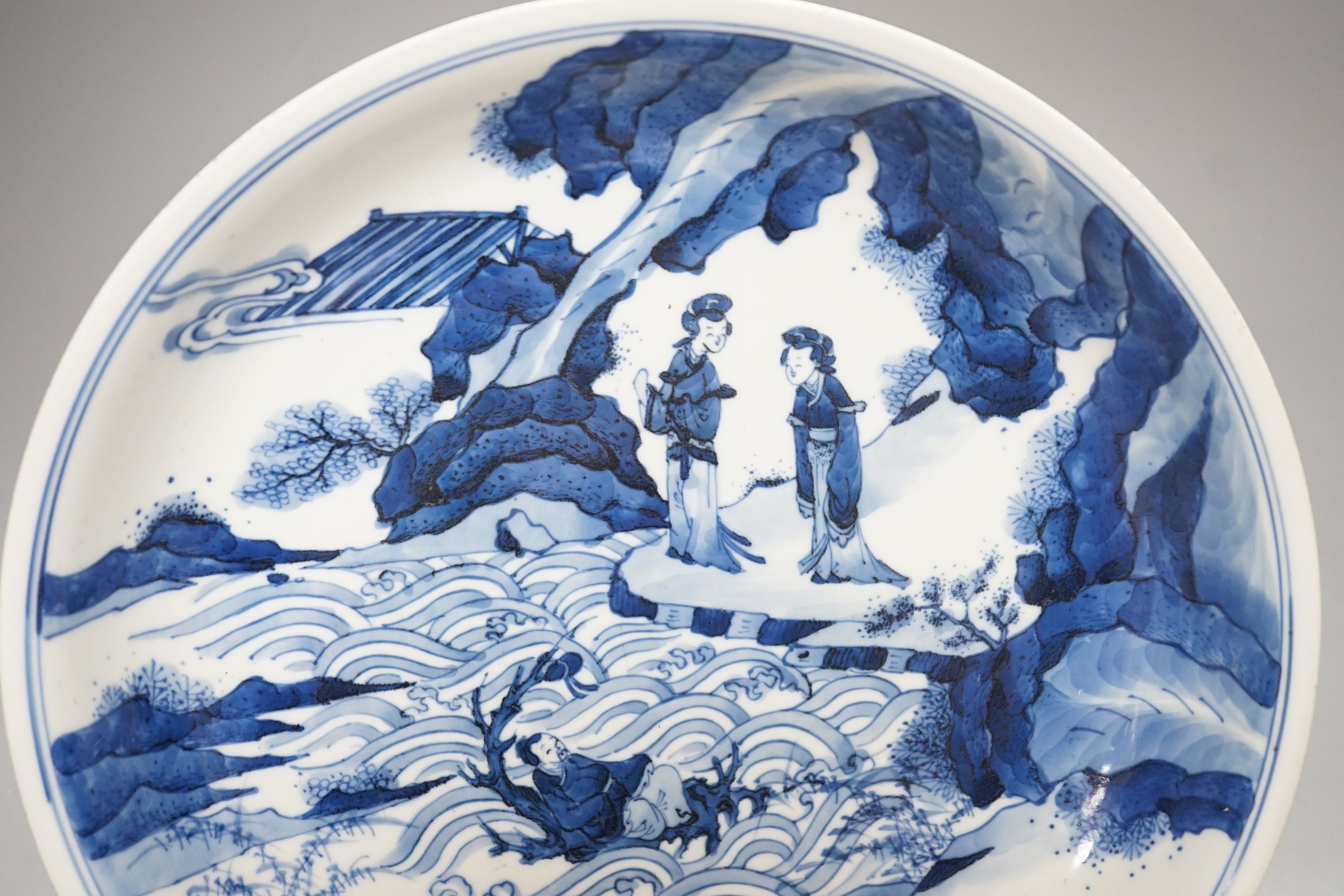 A Chinese blue and white dish, painted with figures, 27cm